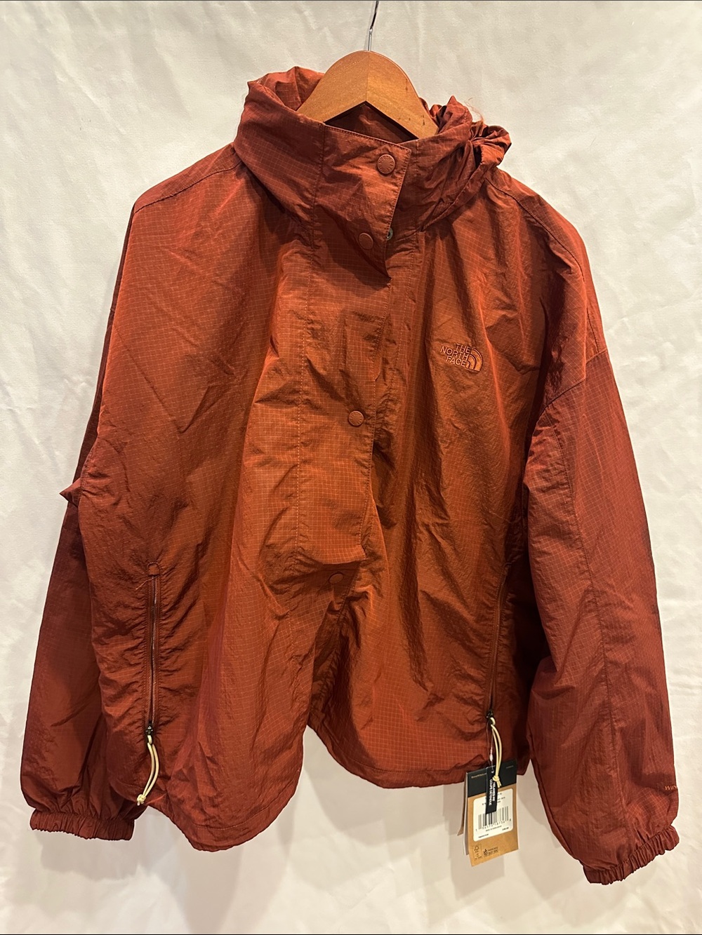 The North Face womens Rust Orange Hooded Windbreaker Jacket,NWT, retail $140